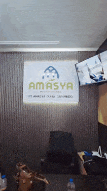 a room with a sign that says amasya