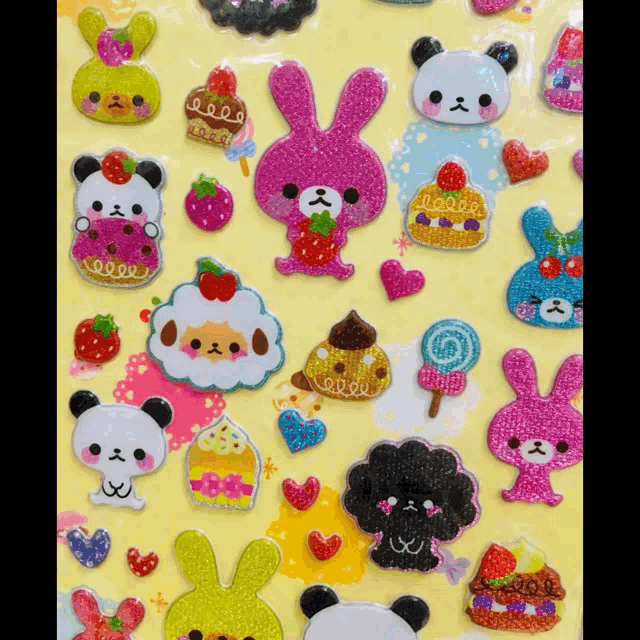 a bunch of stickers on a yellow background including a pink bunny and a panda bear