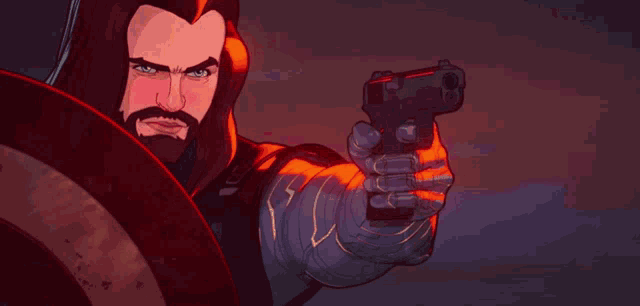 a man with a beard is holding a gun in his hand