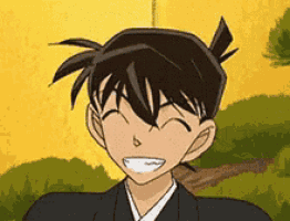 a close up of a cartoon character smiling with his eyes closed and his mouth open .