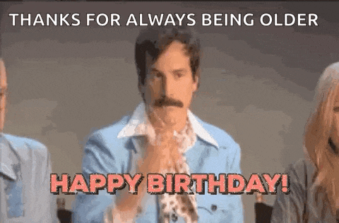 a man with a mustache is clapping his hands and saying `` thanks for always being older happy birthday '' .