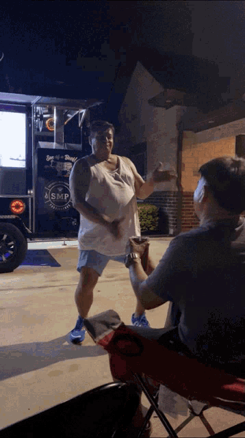 a man standing in front of a msmp food truck