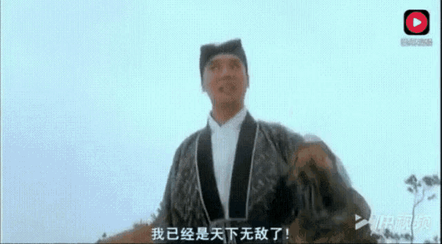 a man wearing a hat and a jacket is waving his hand .