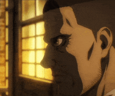 a close up of a man 's face with a shadow on it