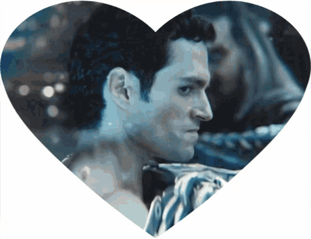 a heart shaped picture of a man with a woman in the background