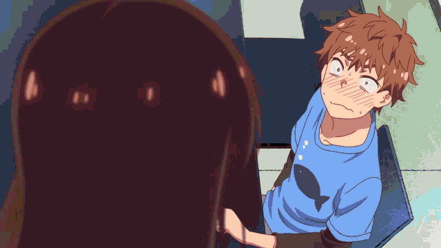 a boy in a blue shirt with a fish on it looks at a girl