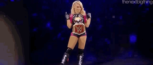 a woman in a wrestling outfit is walking on a stage with a wrestling belt around her waist .