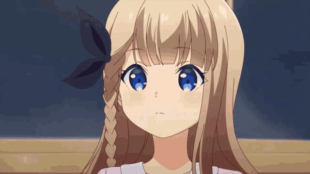 a girl with blonde hair and blue eyes has a black bow in her hair