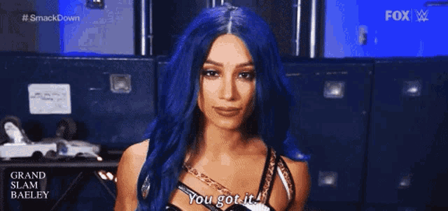 a woman with blue hair says you got it .