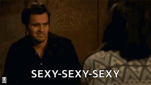 a man is talking on a cell phone and a woman is looking at him and saying `` sexy-sexy-sexy '' .