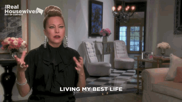 a woman says living my best life in a room