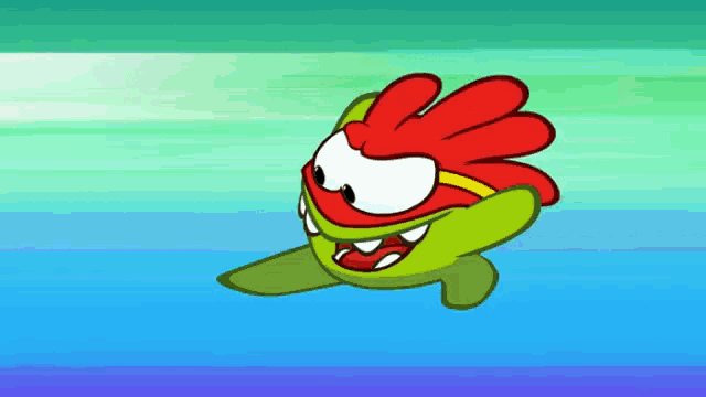 a green cartoon character with a red head and red gloves