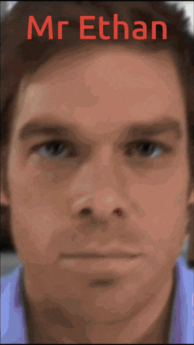 a close up of a man 's face with the name mr. ethan in red letters