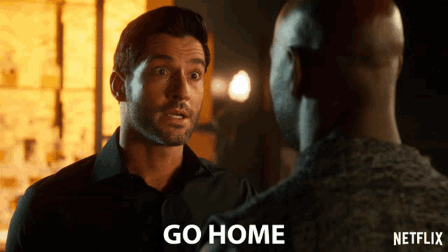 a man talking to another man with the word go home on the bottom