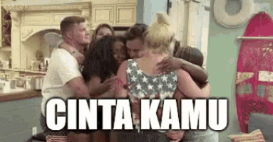 a group of people hugging each other in a room with the words cinta kamu written on the bottom .