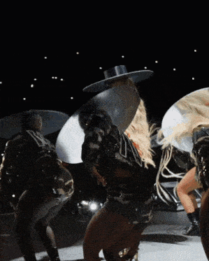 a woman in a camo outfit is dancing with a man in a military uniform