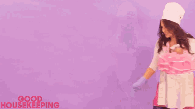 a woman wearing a hat and gloves is walking on a purple background with the words good housekeeping written on it .