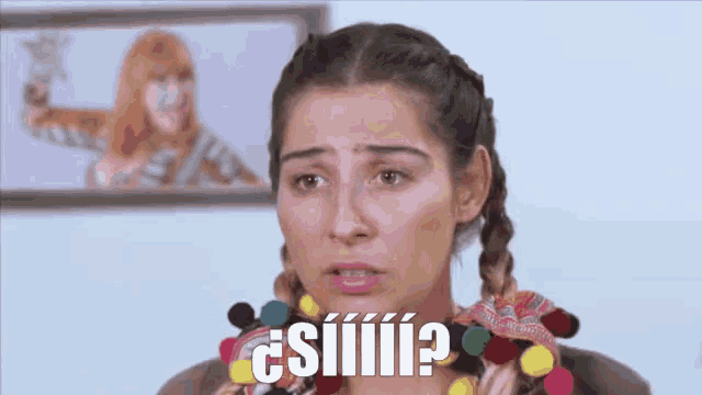 a woman with braids is making a funny face and the words " siiiii " are above her head