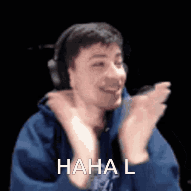 a man wearing headphones is clapping his hands in the air with the words ' haha l ' written on the bottom .