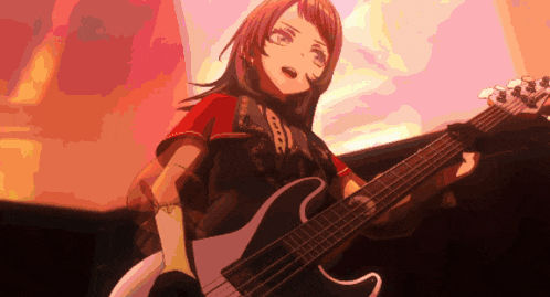 a girl in a red shirt is holding a guitar