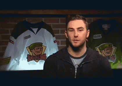 a man stands in front of a jersey that says ' battalion ' on the front