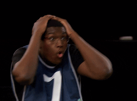 a man wearing a number 7 jersey holds his head