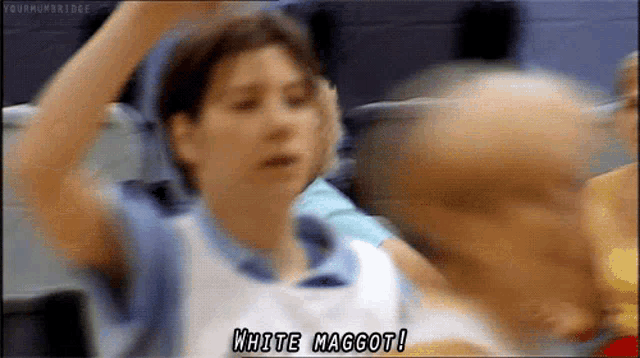 a blurry picture of a woman saying white maggot !