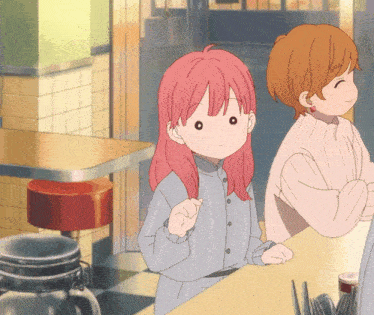 a girl with pink hair is sitting at a counter in a diner