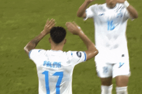 two soccer players one of whom has the number 16 on his back