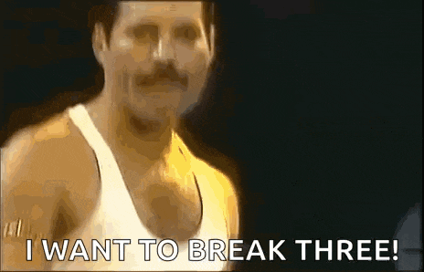 a man with a mustache is wearing a white tank top and says `` i want to break three ! ''