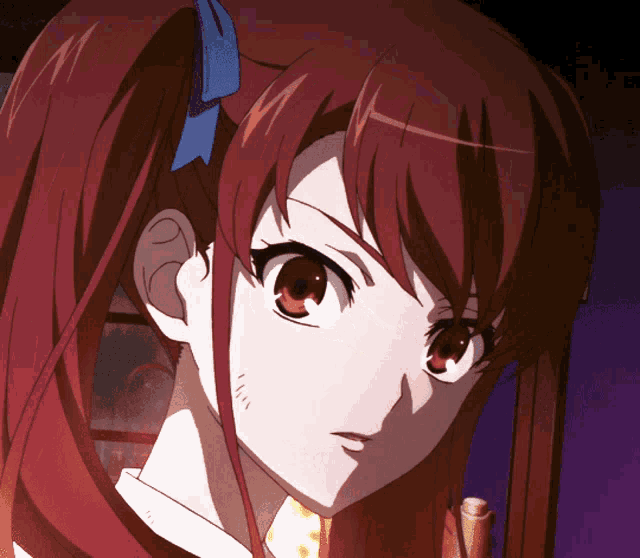 a close up of a girl 's face with red hair and red eyes