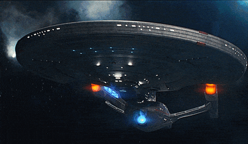 a space ship with a blue light on the front of it