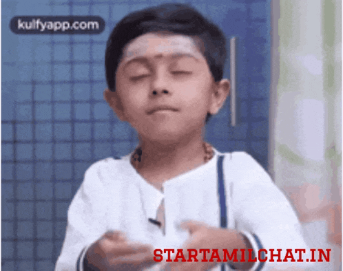 a young boy is making a funny face with the words starttamilchat.in written below him