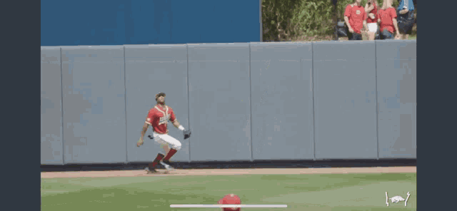 a baseball player in a red jersey with the number 25 on it