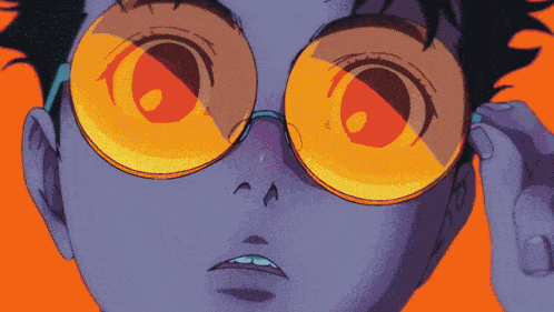 a close up of a person 's face with glasses on