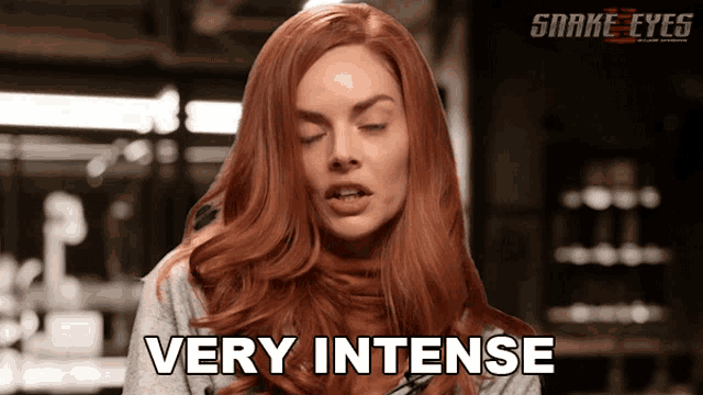 a woman with red hair says very intense in a snake eyes ad