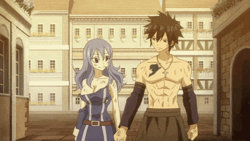 a man and a woman are holding hands in front of buildings