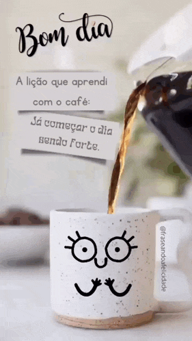 a cup of coffee with a cartoon face on it