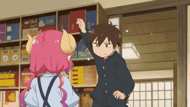a boy and a girl are standing next to each other in a store