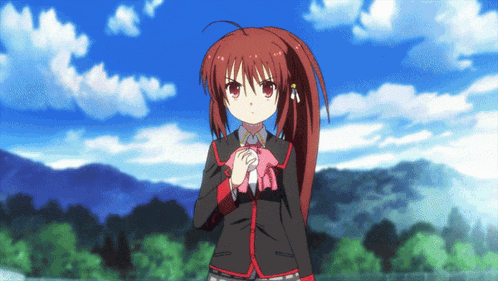 a girl with red hair is holding a stuffed animal in her hands