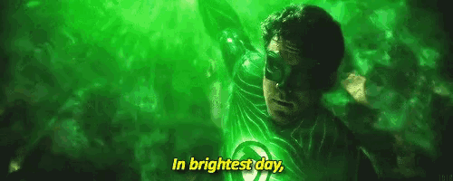 a man in a green lantern costume is saying `` in brightest day . ''