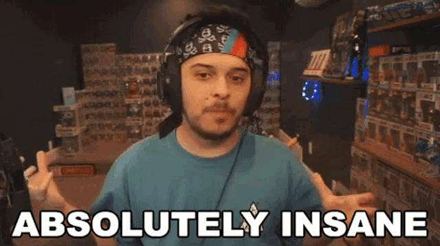 a man wearing headphones says absolutely insane in a video