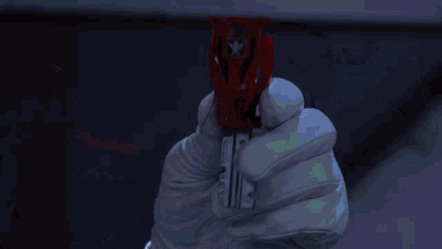 a man in a red helmet with a cross on it
