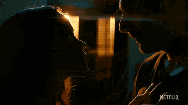 a close up of a man and woman kissing with a netflix logo in the background