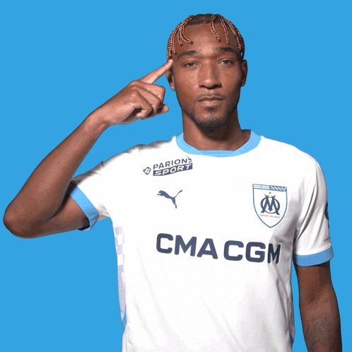 a man wearing a white shirt with cma cgm on the front