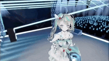 a girl in a white dress is standing on a stage in front of a crowd of people .
