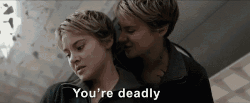 a couple of women standing next to each other with the words `` you 're deadly '' written on the bottom of the image .