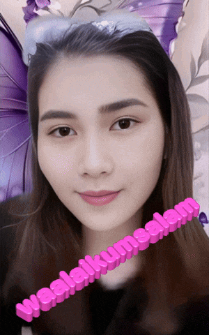 a woman wearing a purple butterfly headband with the words wealaikumsalam written on it