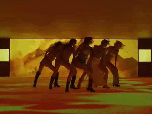 a group of women are dancing in front of a yellow and green background