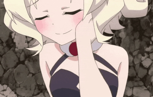 a girl with blonde hair and a red necklace is smiling with her eyes closed